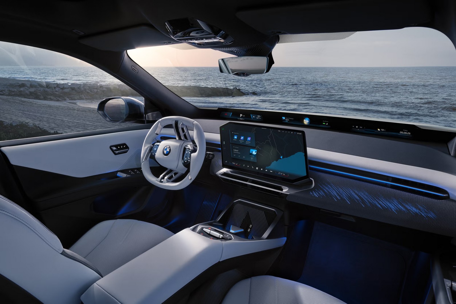 Interior do BMW iX3 com o painel Panoramic Vision e a tela central