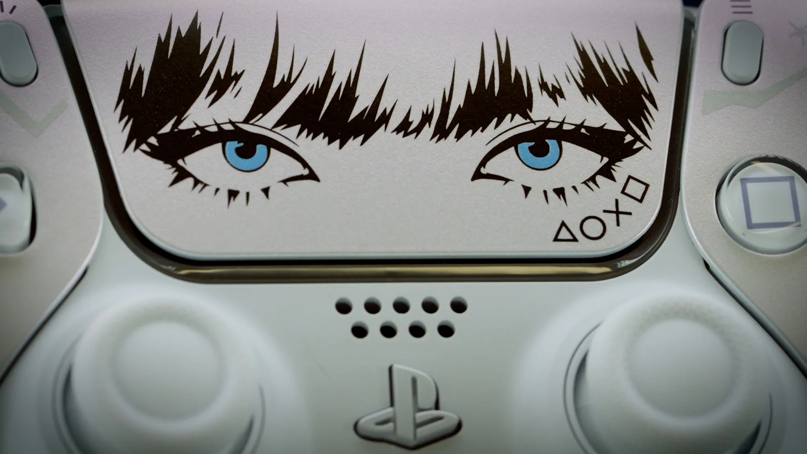 Touchpad do DualSense com a ilustração dos olhos da Lisa