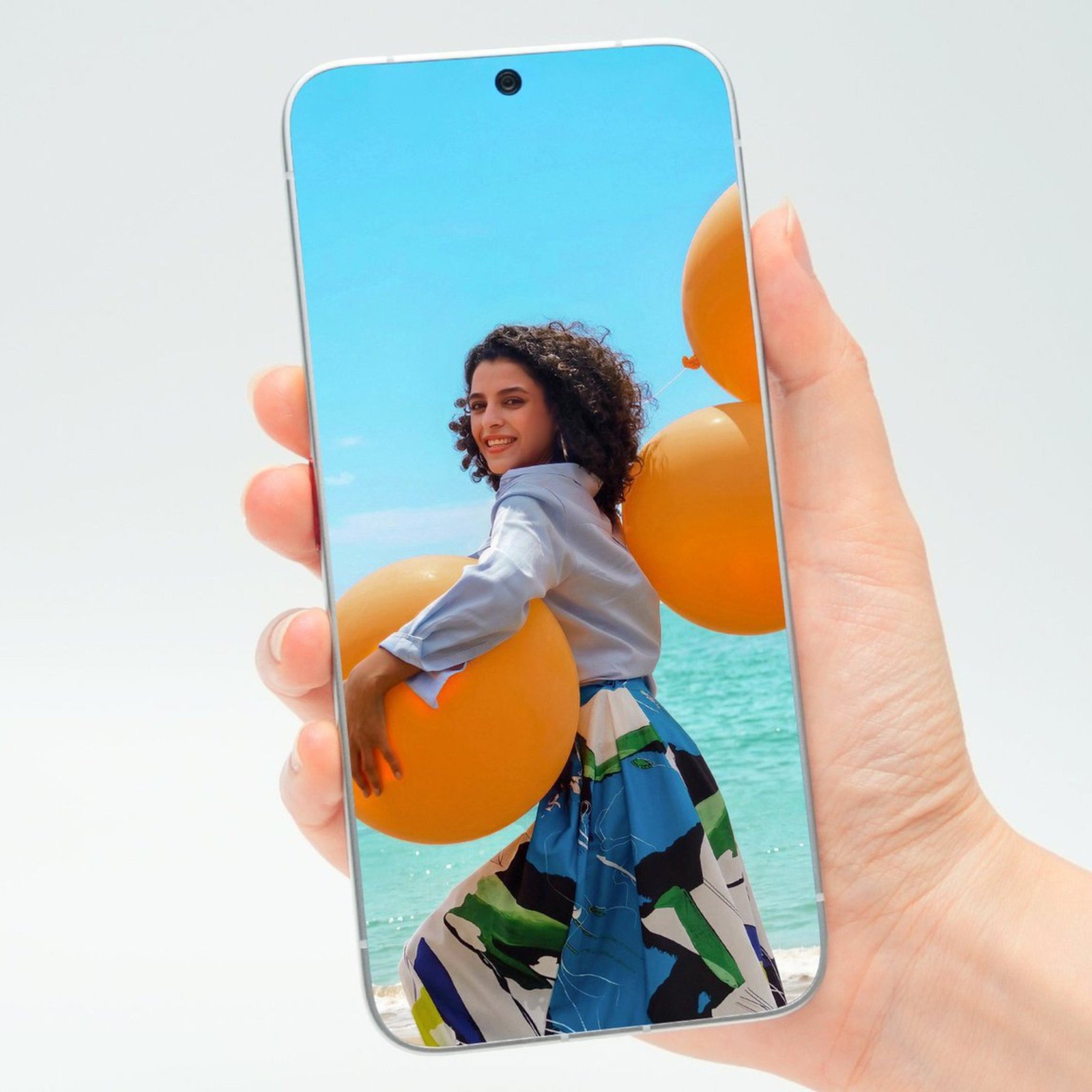 Conceito de iPhone com tela sem bordas e furo para a câmera de selfie
