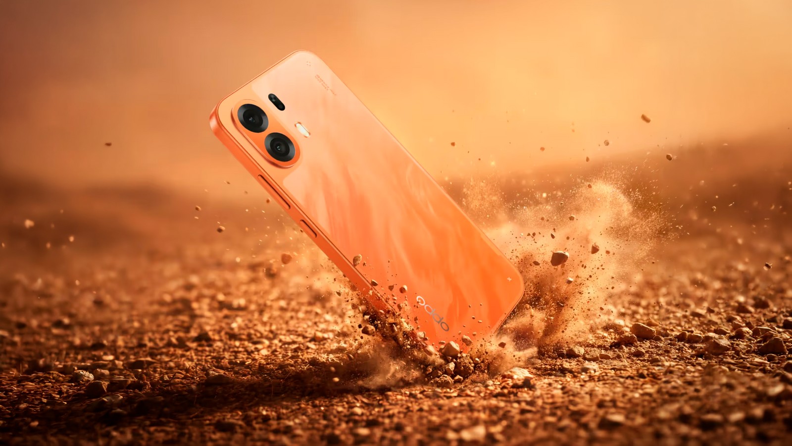 OPPO K14 Plus laranja em superfície de terra